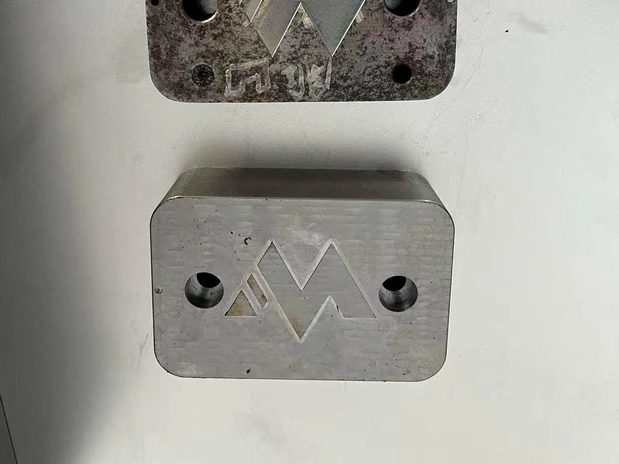 The die · M lid stamp